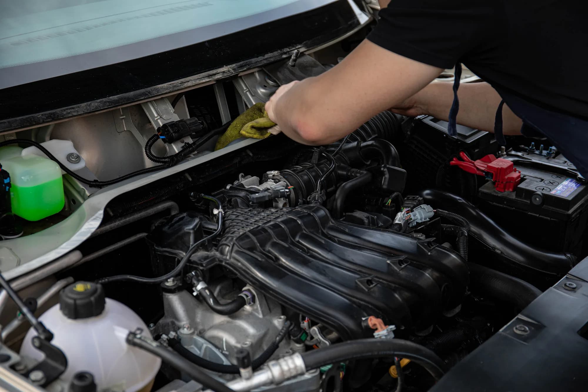 A technician inspecting a vehicle